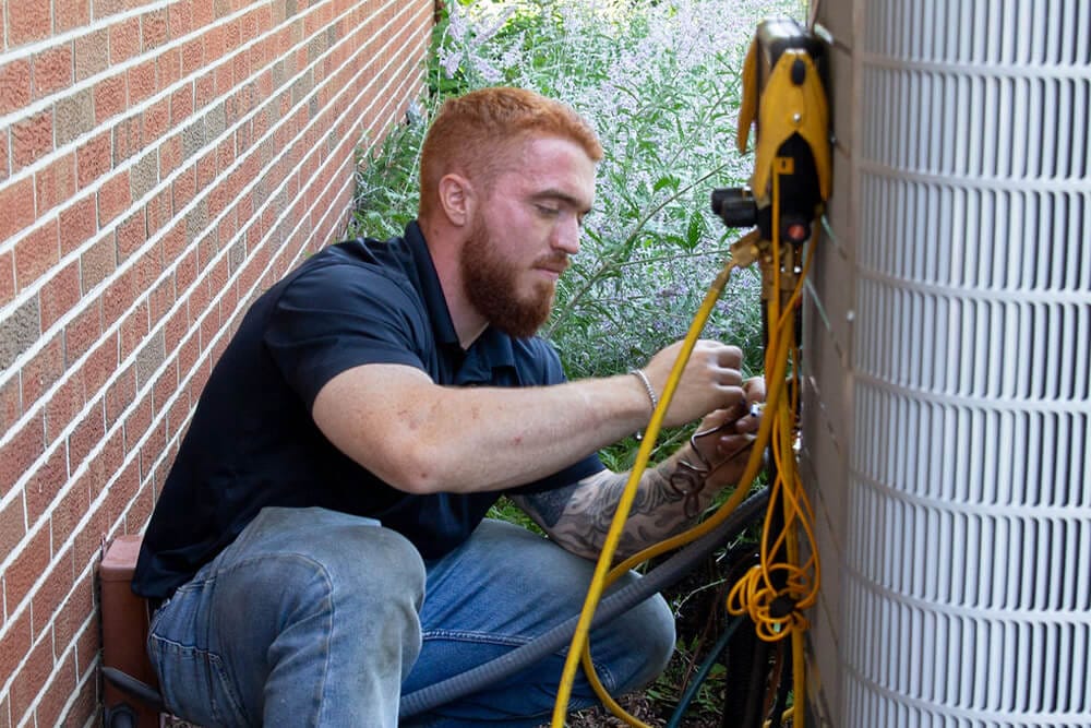 man installing ac