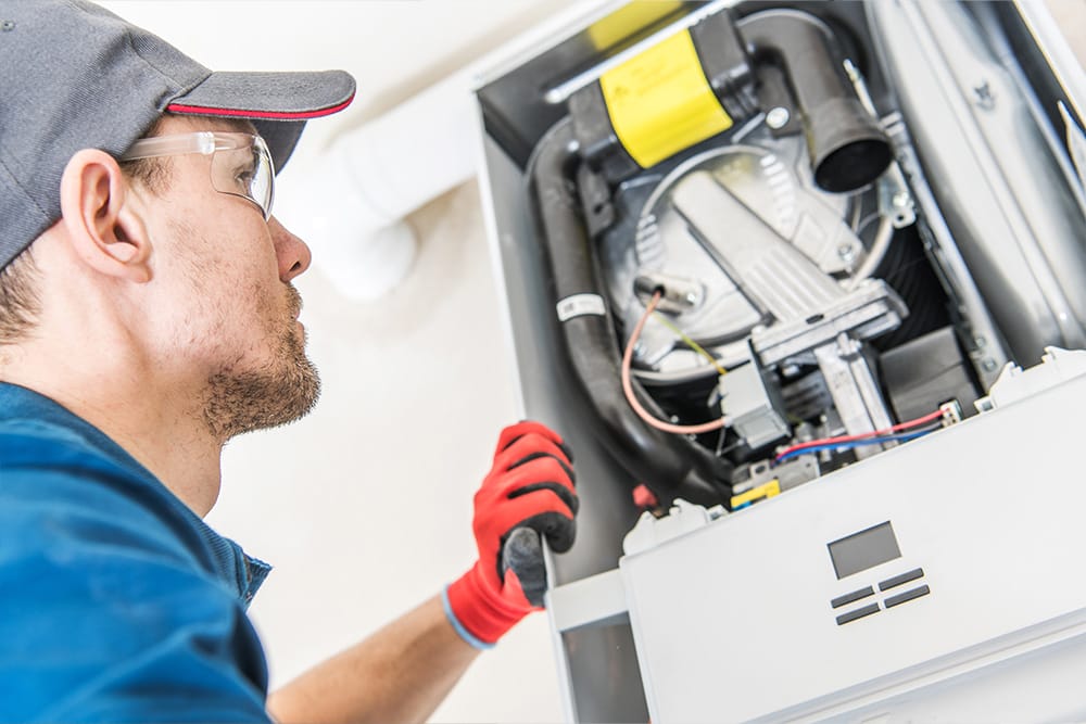 man checking the heating system