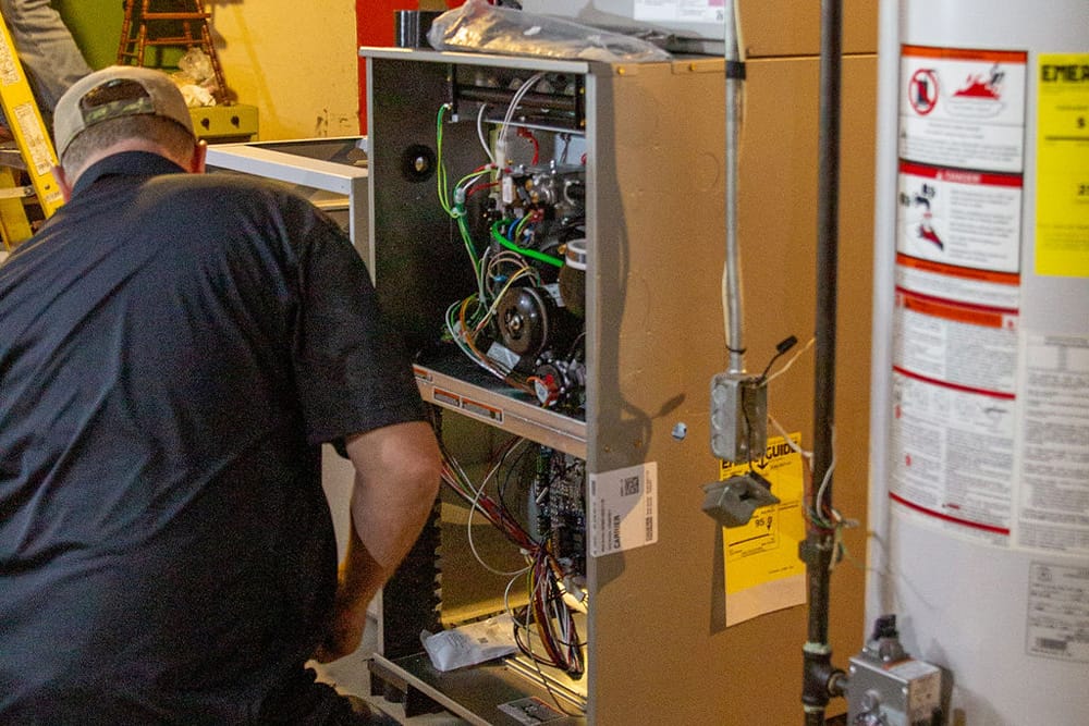 Licensed HVAC technician providing air handler maintenance service in DeKalb County