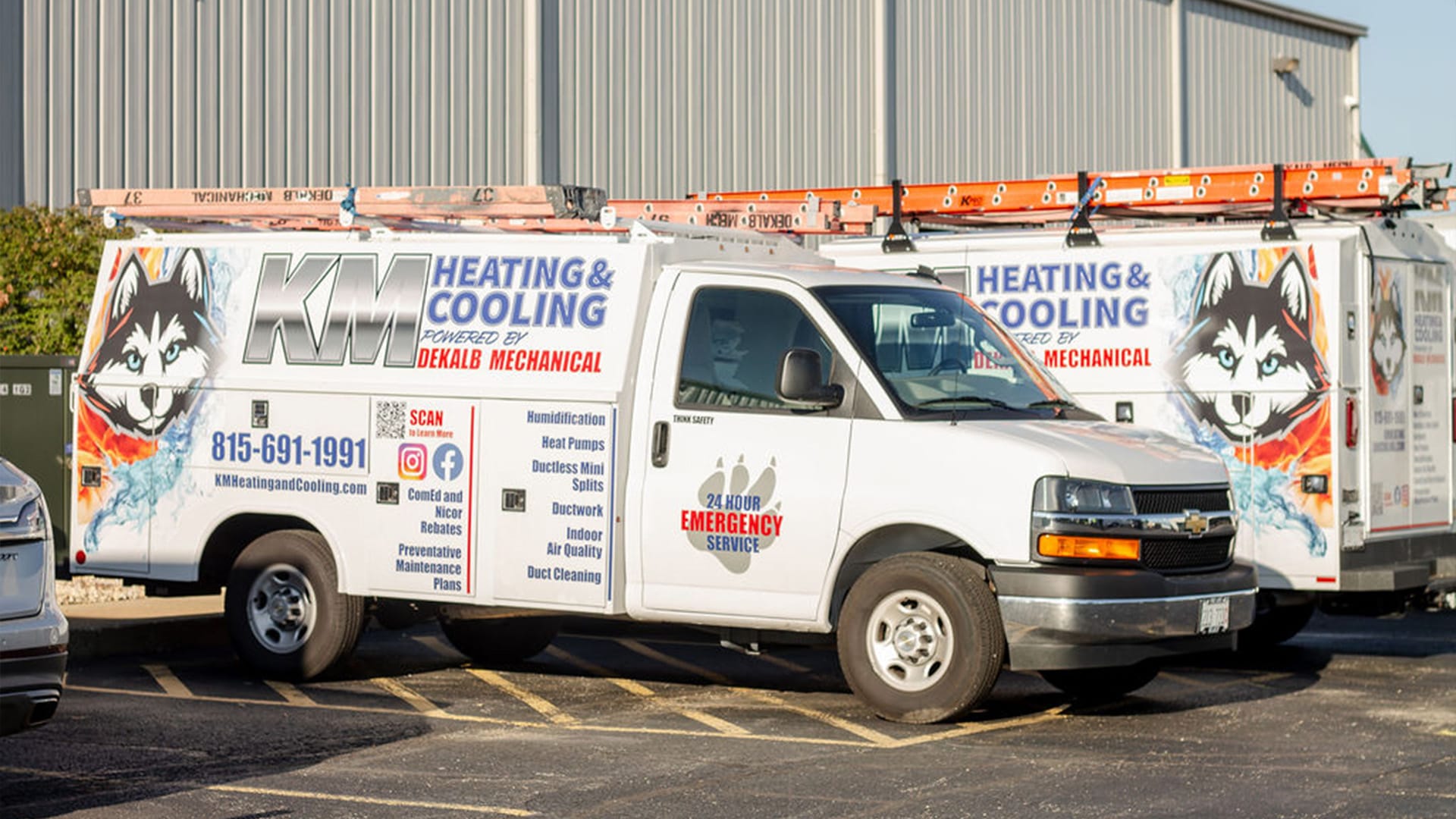 KM Heating and Cooling service vans ready for air handler installation in DeKalb